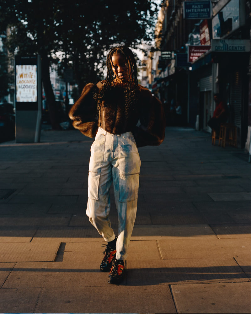 A woman standing in the streets.