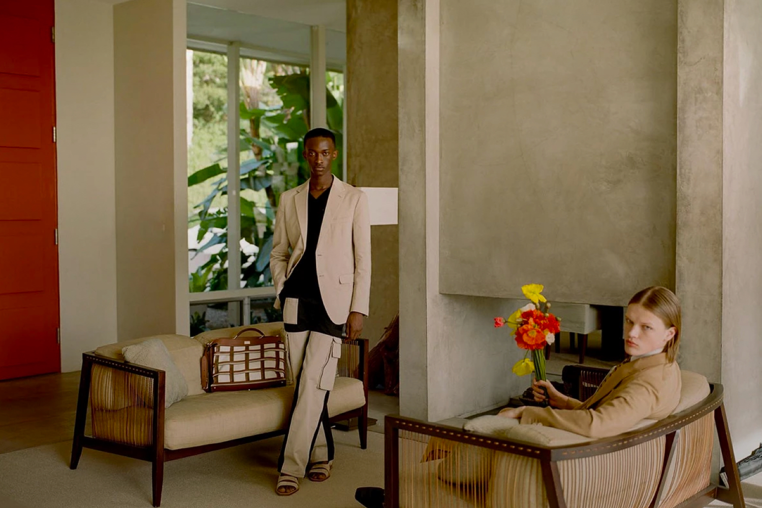 Two men posing in living room.