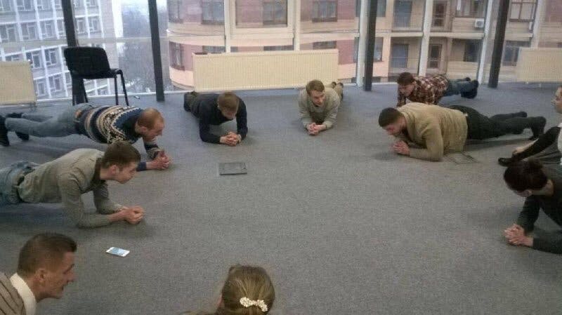 A group of people planking during the standup