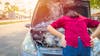 Woman dealing with overheating car