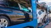 Blue semi truck transporting cars