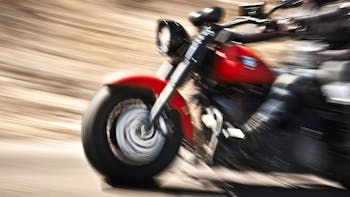 Abstract slow motion, biker riding motorbike