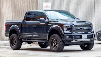 Black Ford F 150 parked