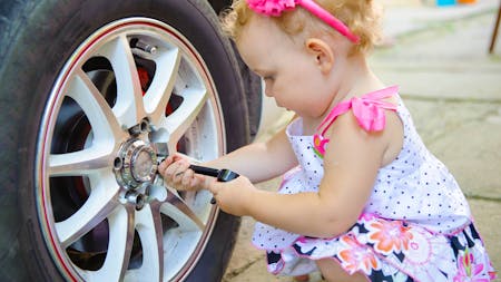 kid changing a tire