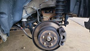 Subaru rear brake rotor suspension