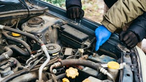 Two Car mechanic engineers checking, fixing the car