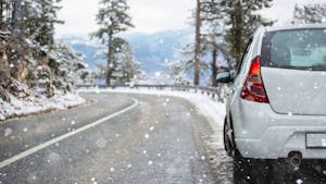 White car on a winter road