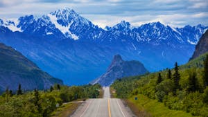 Road in Alaska with a view of a mountain