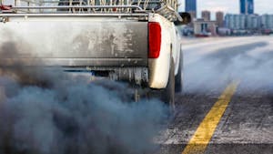 Air pollution crisis in city from diesel vehicle exhaust pipe on