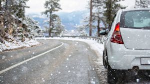 White car on a winter road