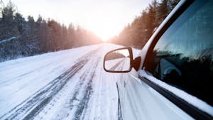 White car on a winter road