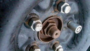 Car Wheel on Vehicle with Lug Nuts