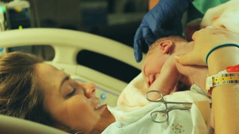 Rachel holds Jack right after he is born