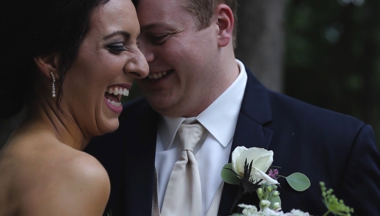 Adam and Kaylin laughing right after their wedding ceremony