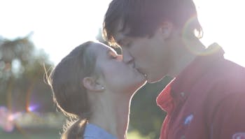 Erin and Chance kiss during their Save the Date video shoot