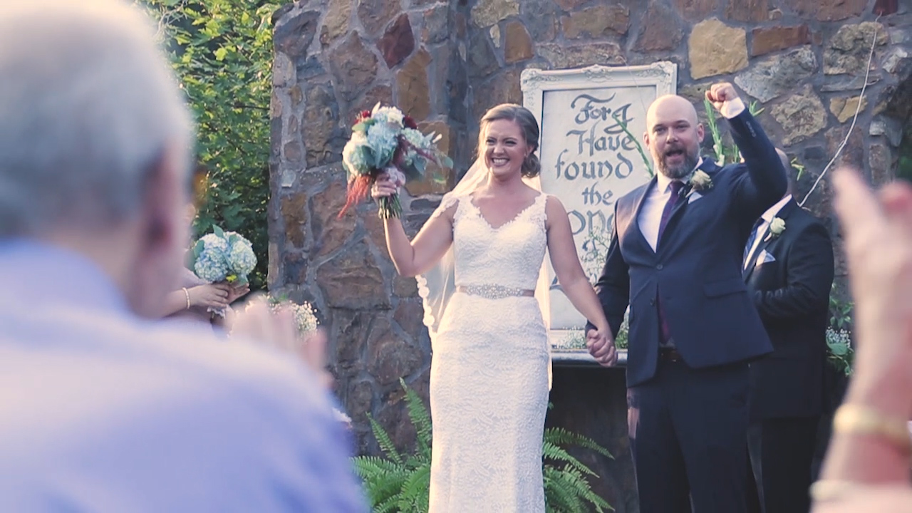 The newlyweds walk the aisle after being pronounced husband and wife