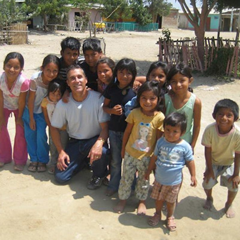 Dr. Morrissette with kids from a small town