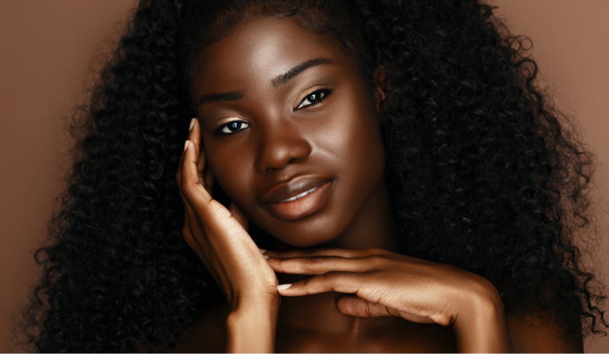 woman touching her face