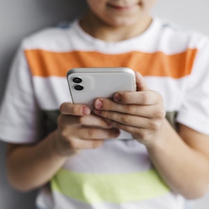 child using mobile phone