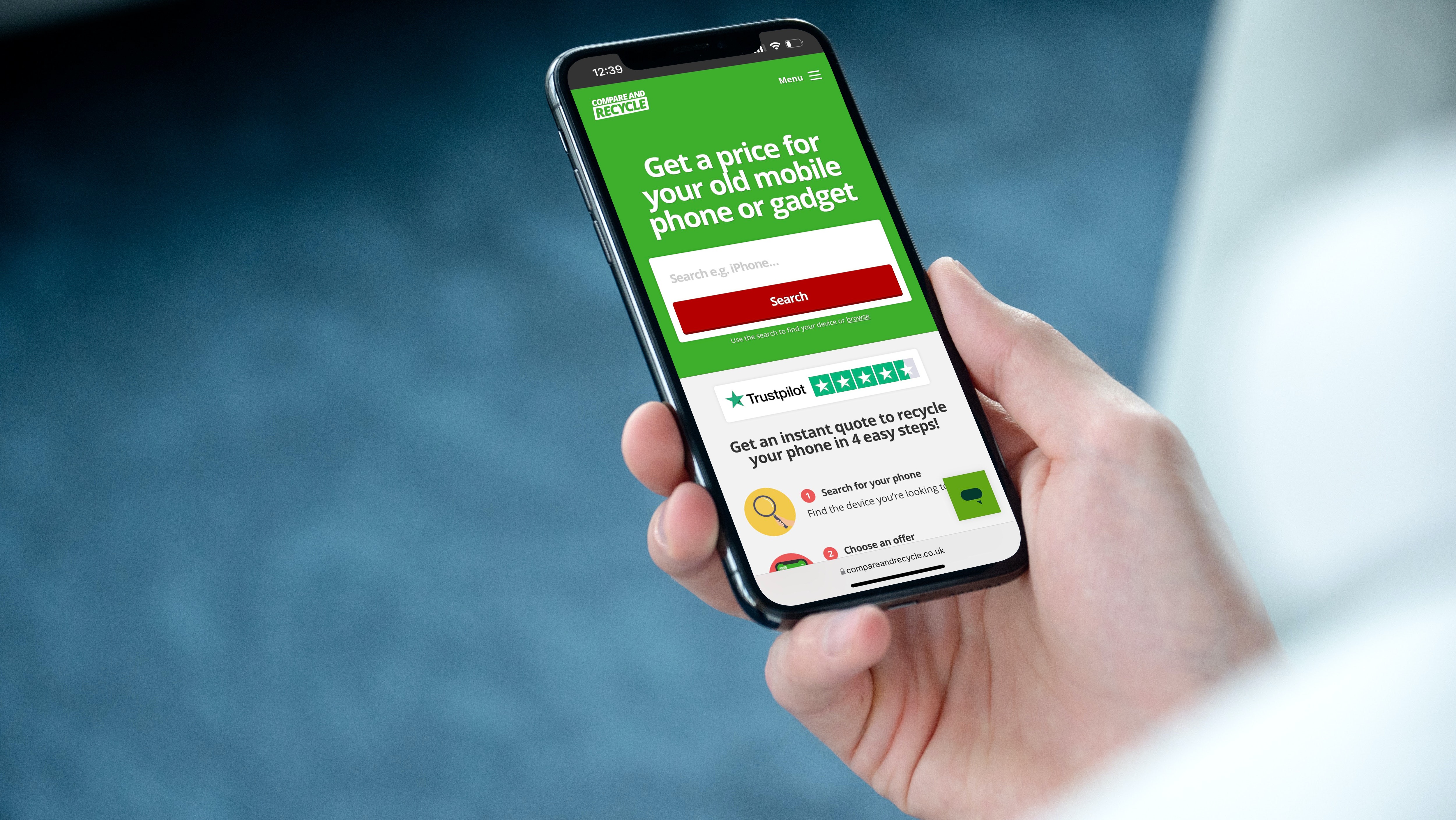 hand holidng a smartphone with Compare and Recycle homepage on the screen