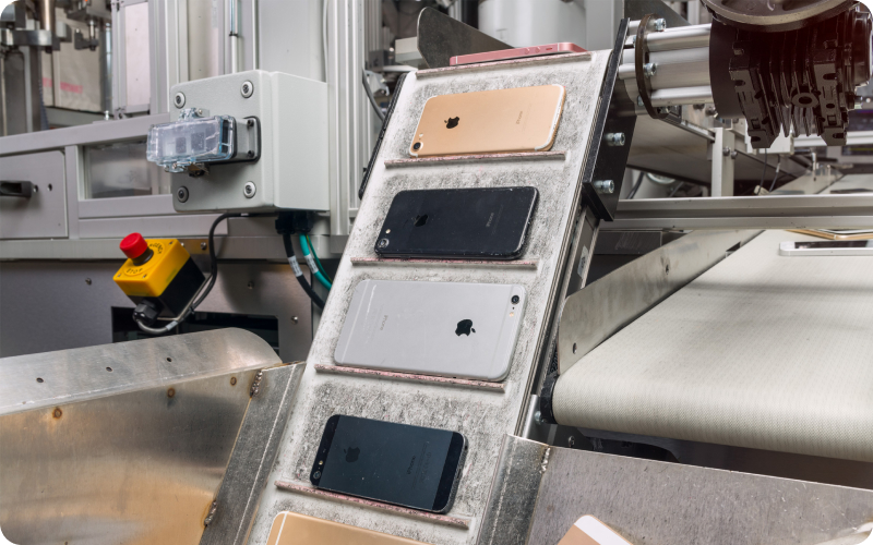 a robot disassembling old mobile phones for recycling