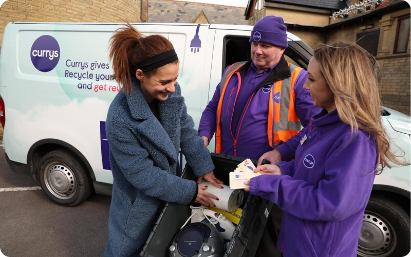 Currys customer putting her household appliances in a box for the retailers take-back scheme