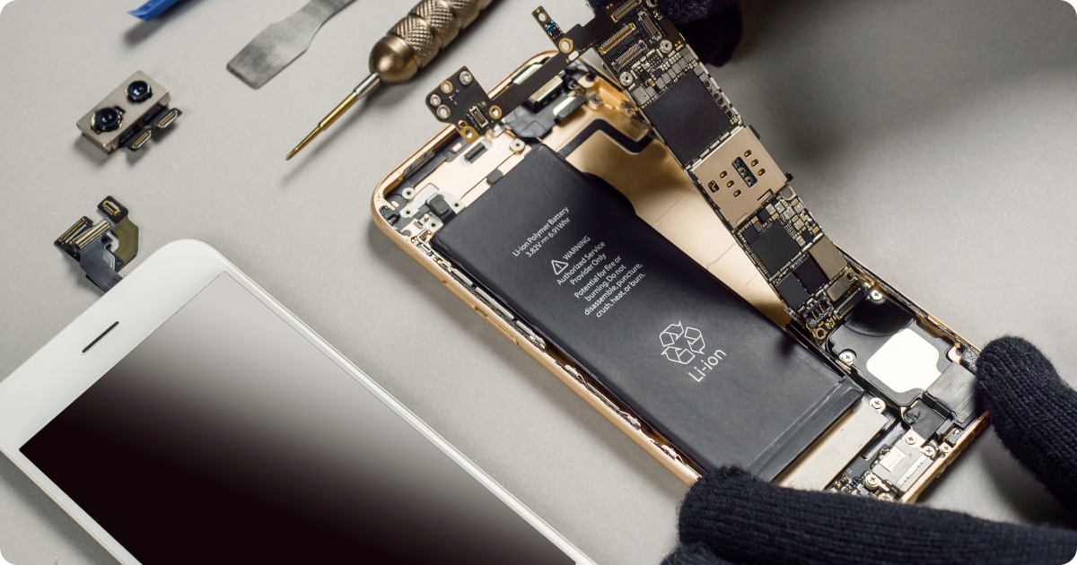 Technician refurbishing a smartphone