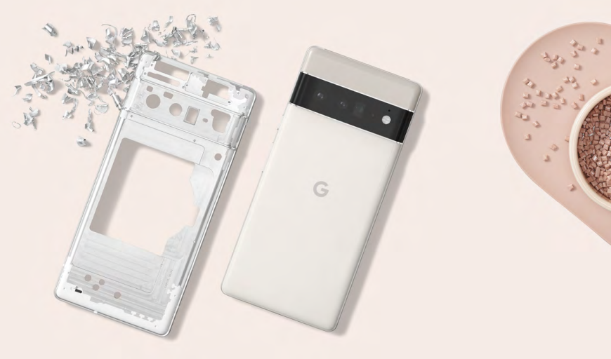 a mobile phone laying flat on the surface with aluminium chippings and plastic components