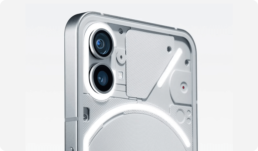 closeup of rear camera of nothing phone 1 in silver on light grey background with