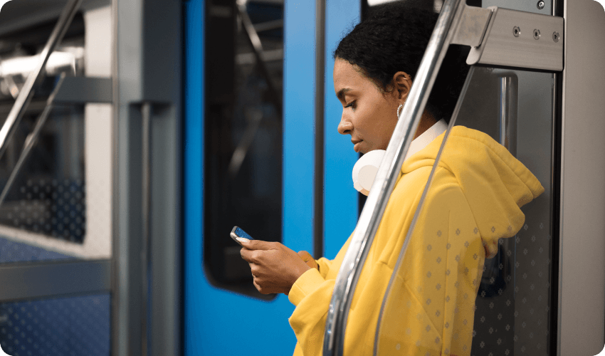 Woman using her mobile phone on a train