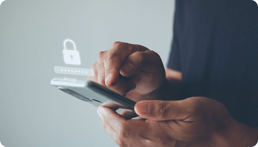 hands holding a mobile phone with lock and encryped password projection above the screen