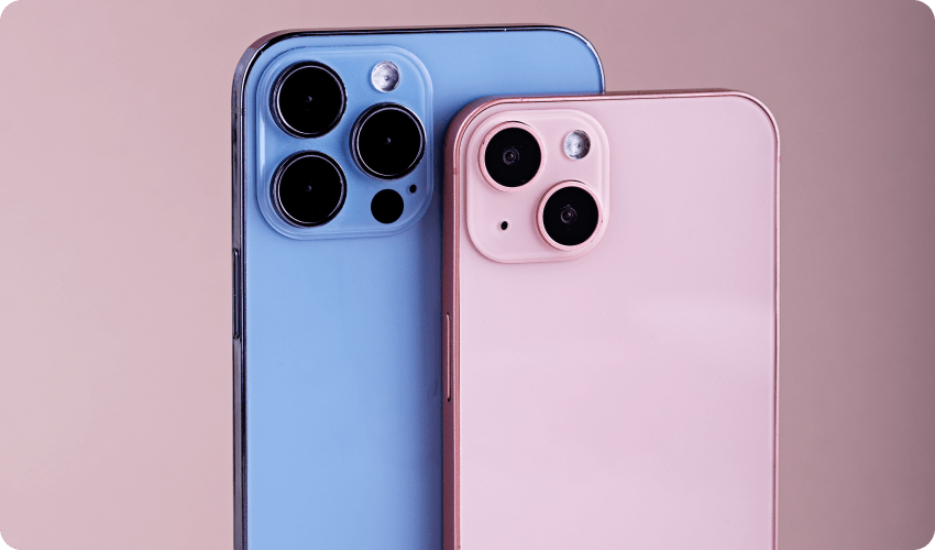 Blue and pink iPhone on pink background