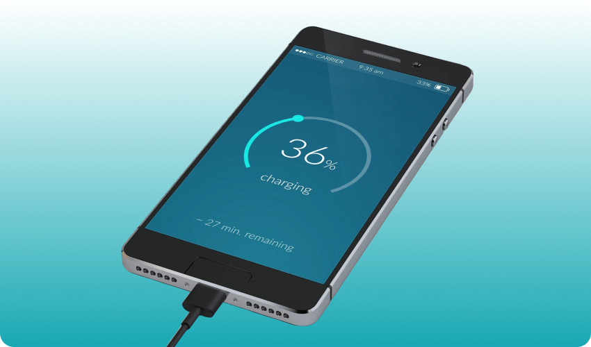 Mobile phone plugged in charging showing charge percentage on the screen