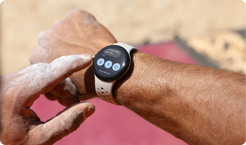 Close-up shot of a person's hands tapping on their smartwatch.