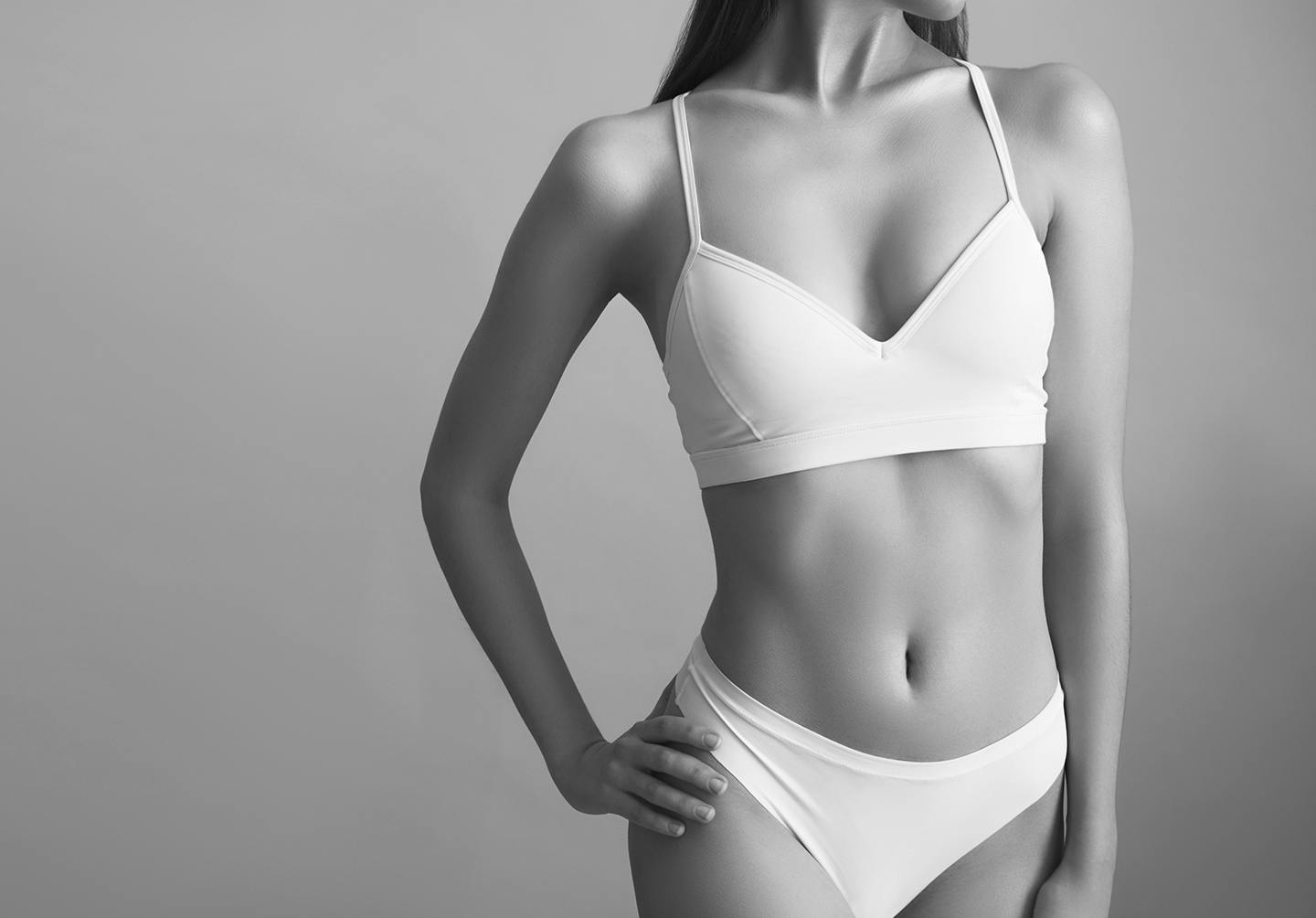Woman posing wearing white underwear.