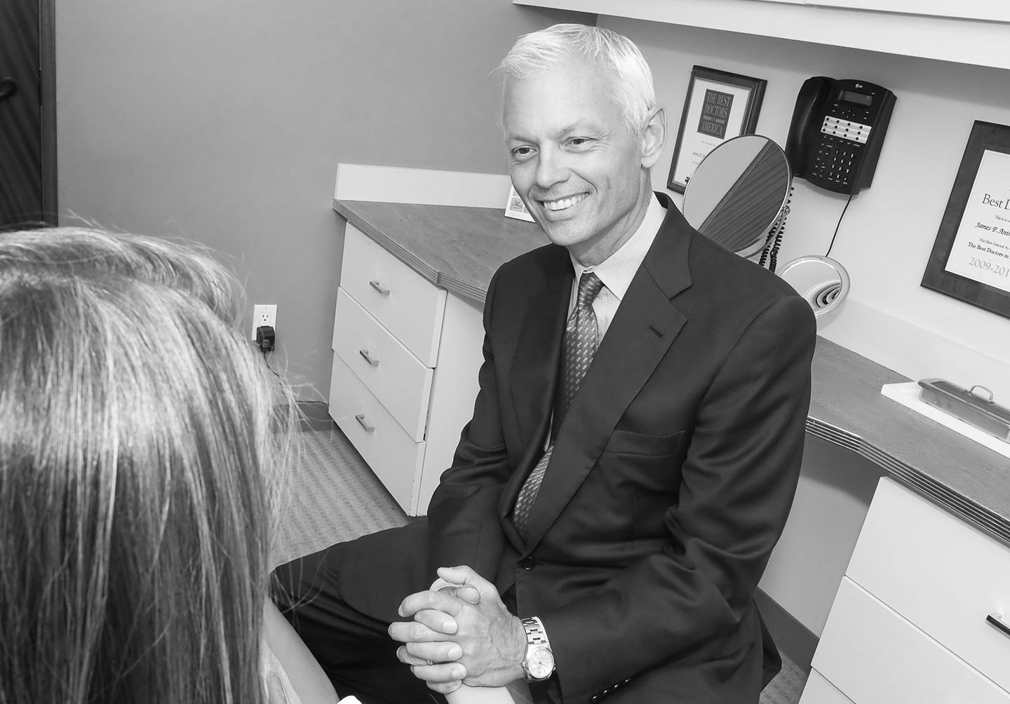 Dr. Anthony talking with a woman client