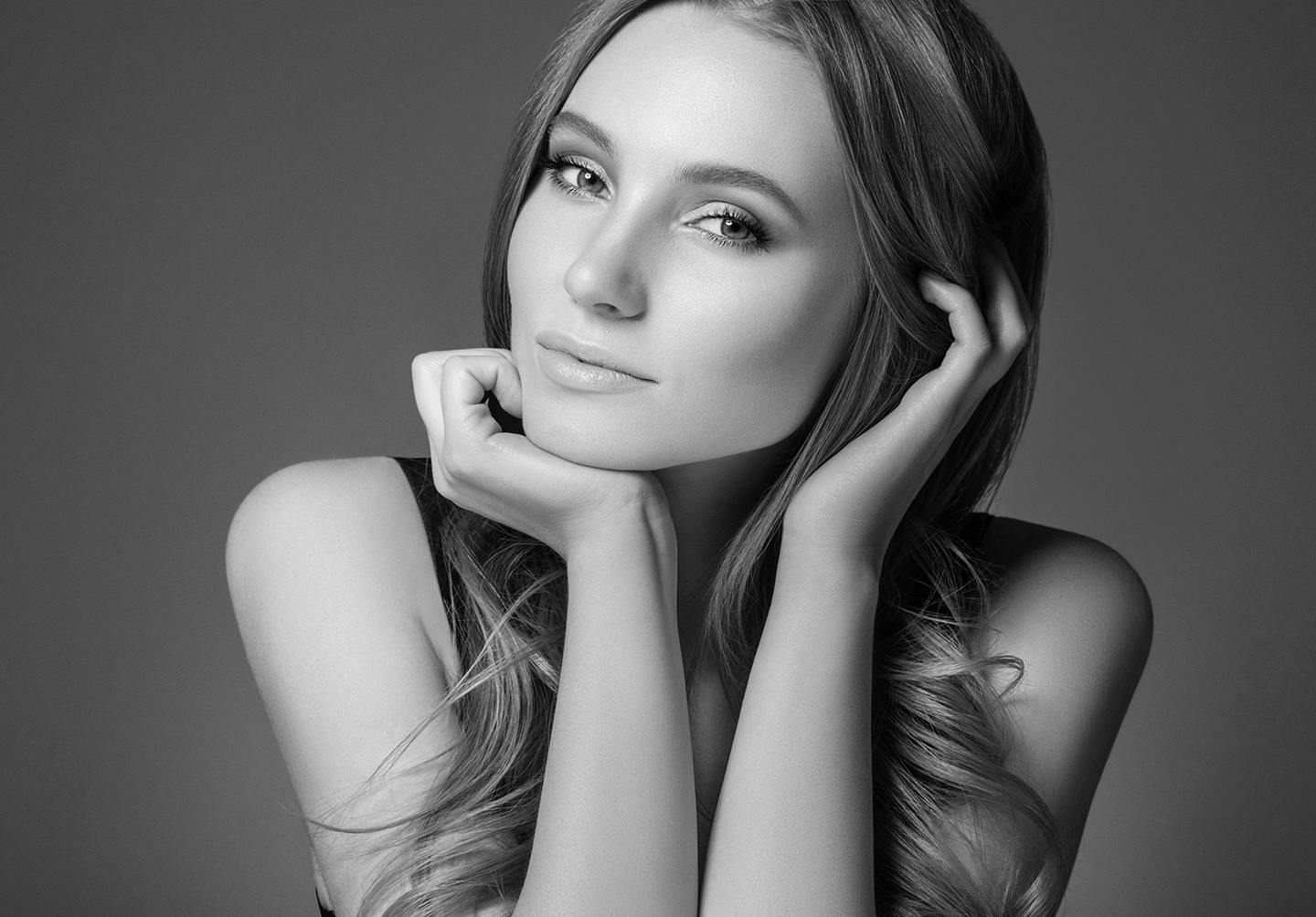 Black and White Photo of Woman with Her Head in Her Hands