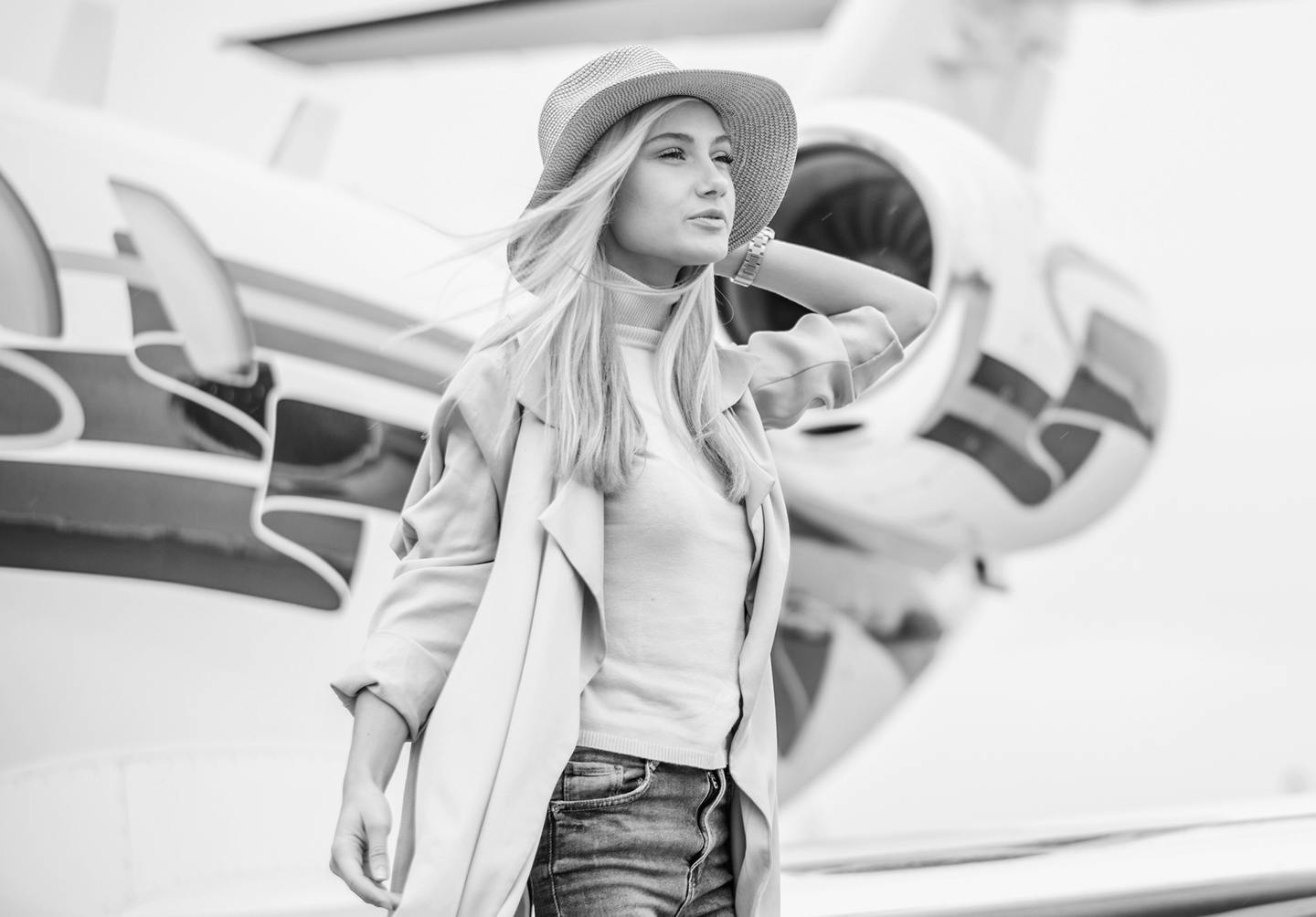 Woman in Front of an Airplane