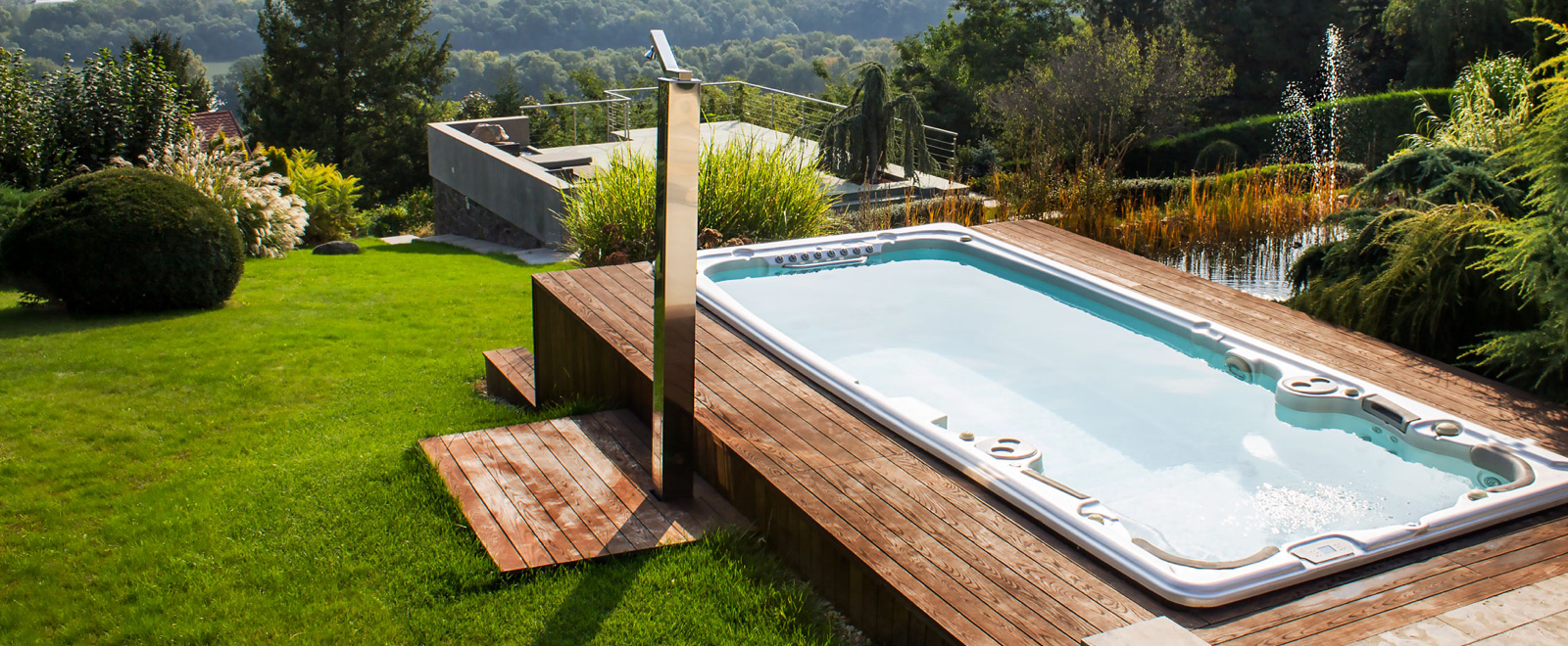 Jacuzzi J-19 Power Active swim spa in a posh backyard overlooking the mountains
