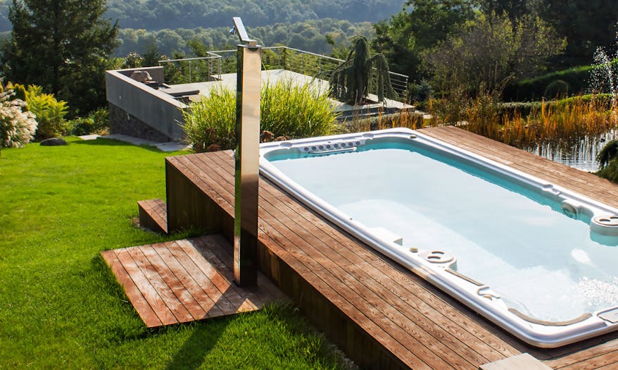 Jacuzzi J-19 Power Active swim spa in a posh backyard overlooking the mountains