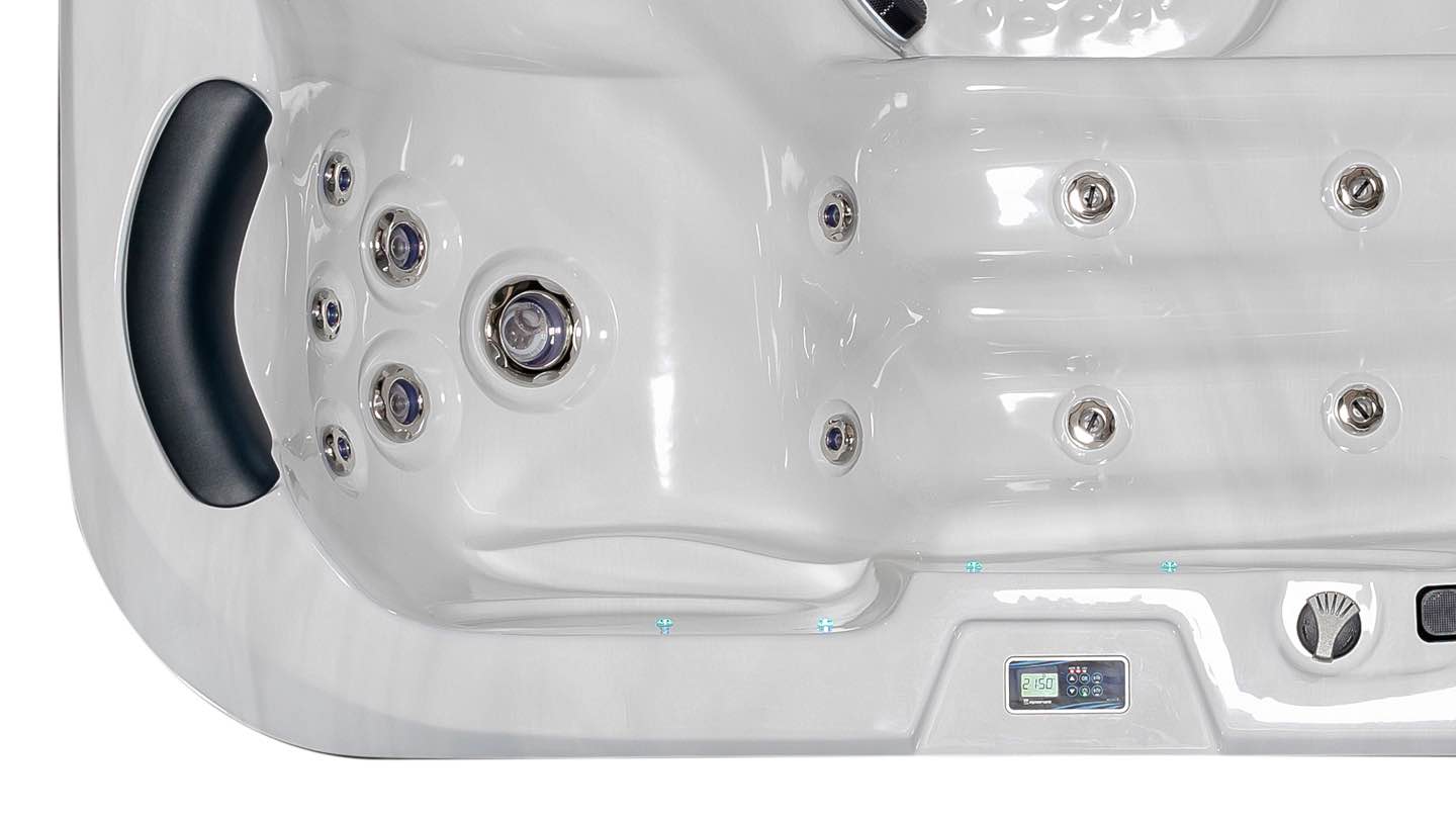 Close-up of the Fisher 3 Spa's hydromassage lounger, showcasing ergonomic design and built-in foot massage jets for a luxurious spa experience.