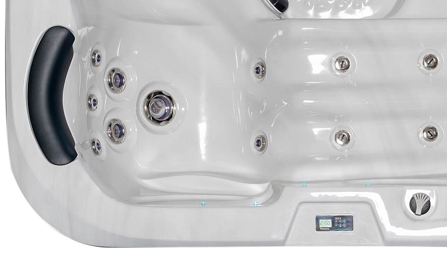 Close-up of the Fisher 3 Spa's hydromassage lounger, showcasing ergonomic design and built-in foot massage jets for a luxurious spa experience.