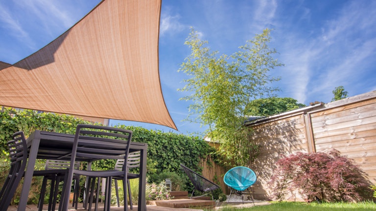 Shade sail in backyard