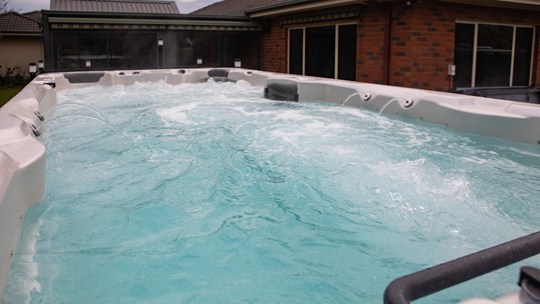 swim spa in a backyard