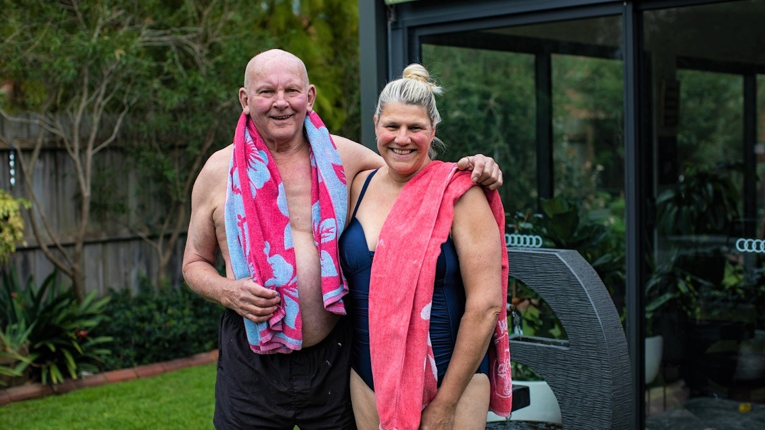 Happy couple going for a swim