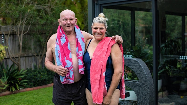 Happy couple going for a swim