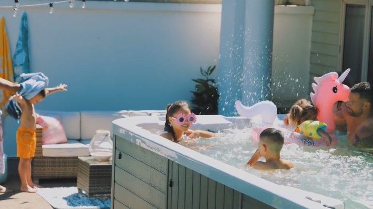 family enjoying in a swim spa