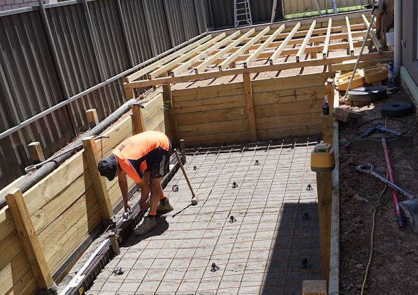 Concrete base for in-ground swim spa pit