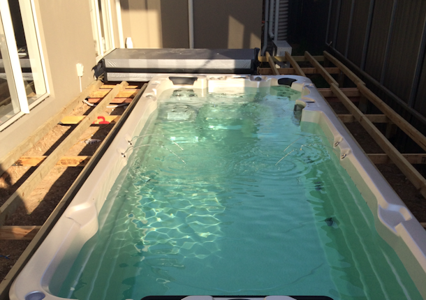 swim spa pool with decking in a pit