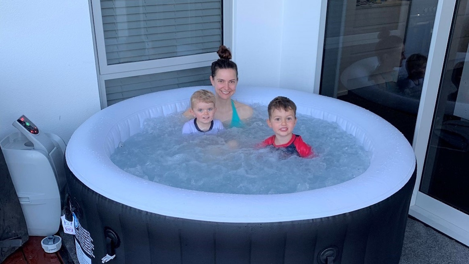 mother and kids in an inflatable spa